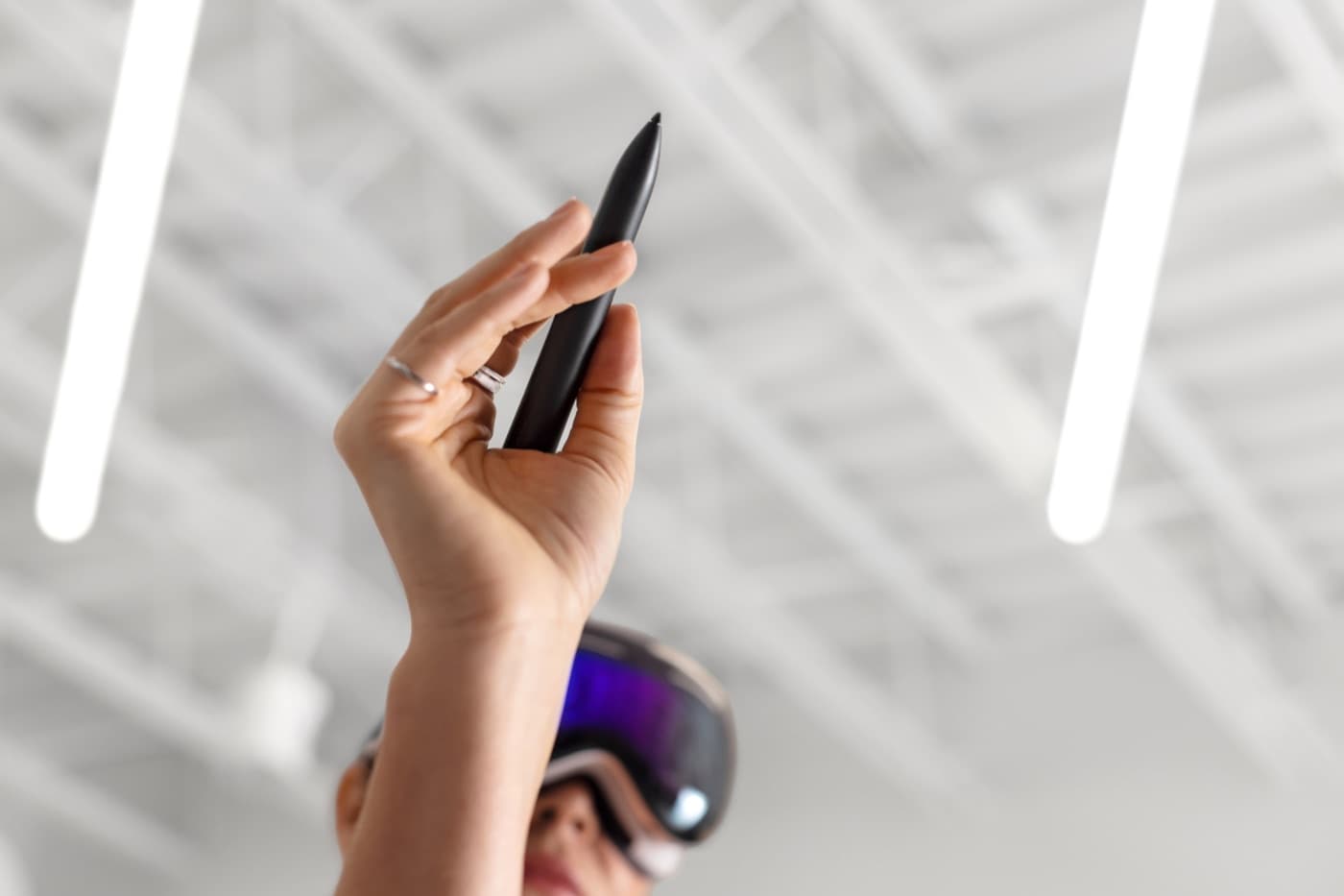 A person wearing Apple Vision Pro holds Logitech Muse while drawing in 3D