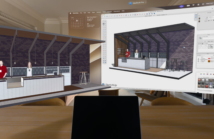 A Mac previews an editable 3D scene in the space around Apple Vision Pro