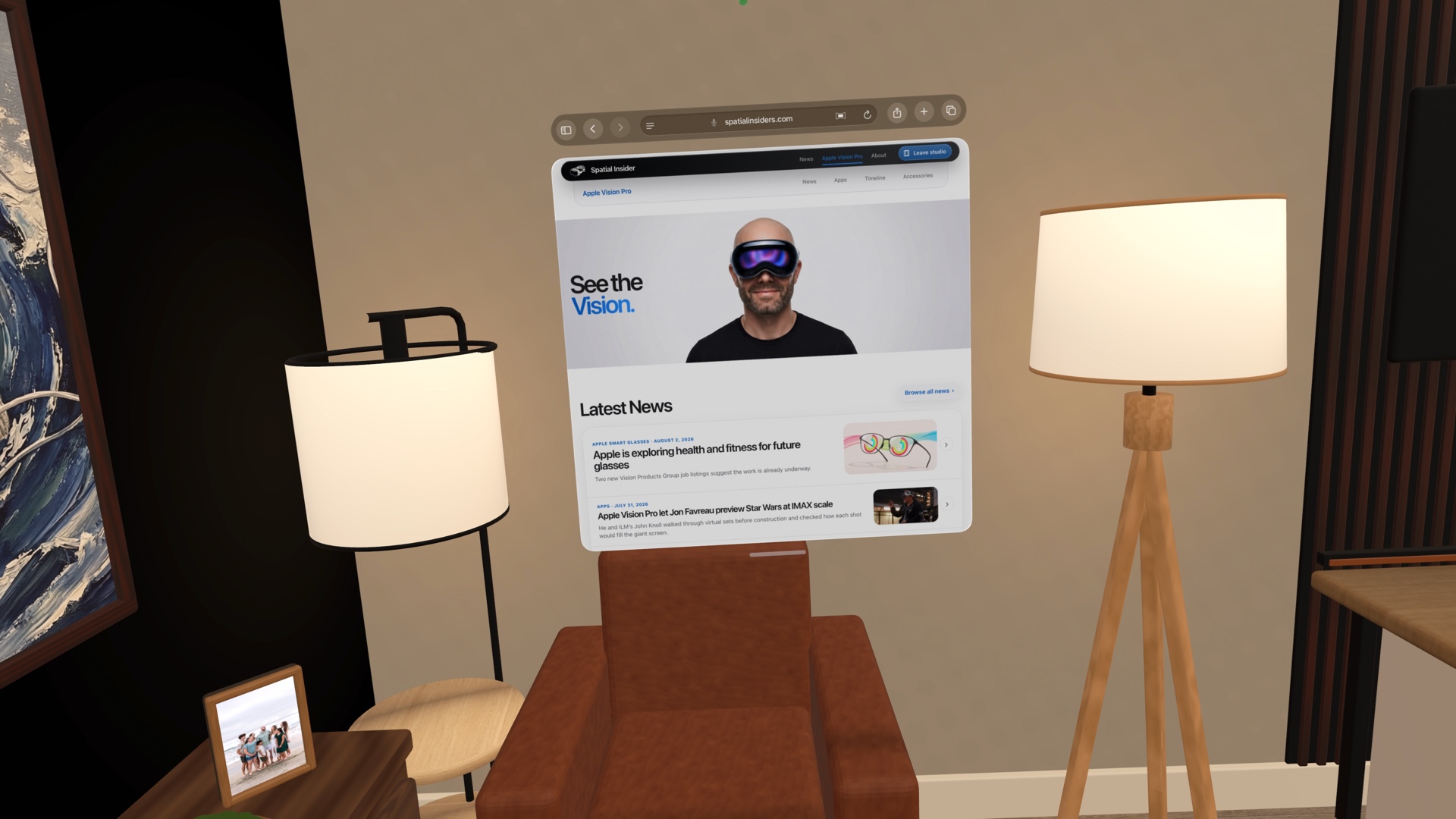 The live Spatial Insider website floating above a chair between two warm lamps inside its latest immersive studio