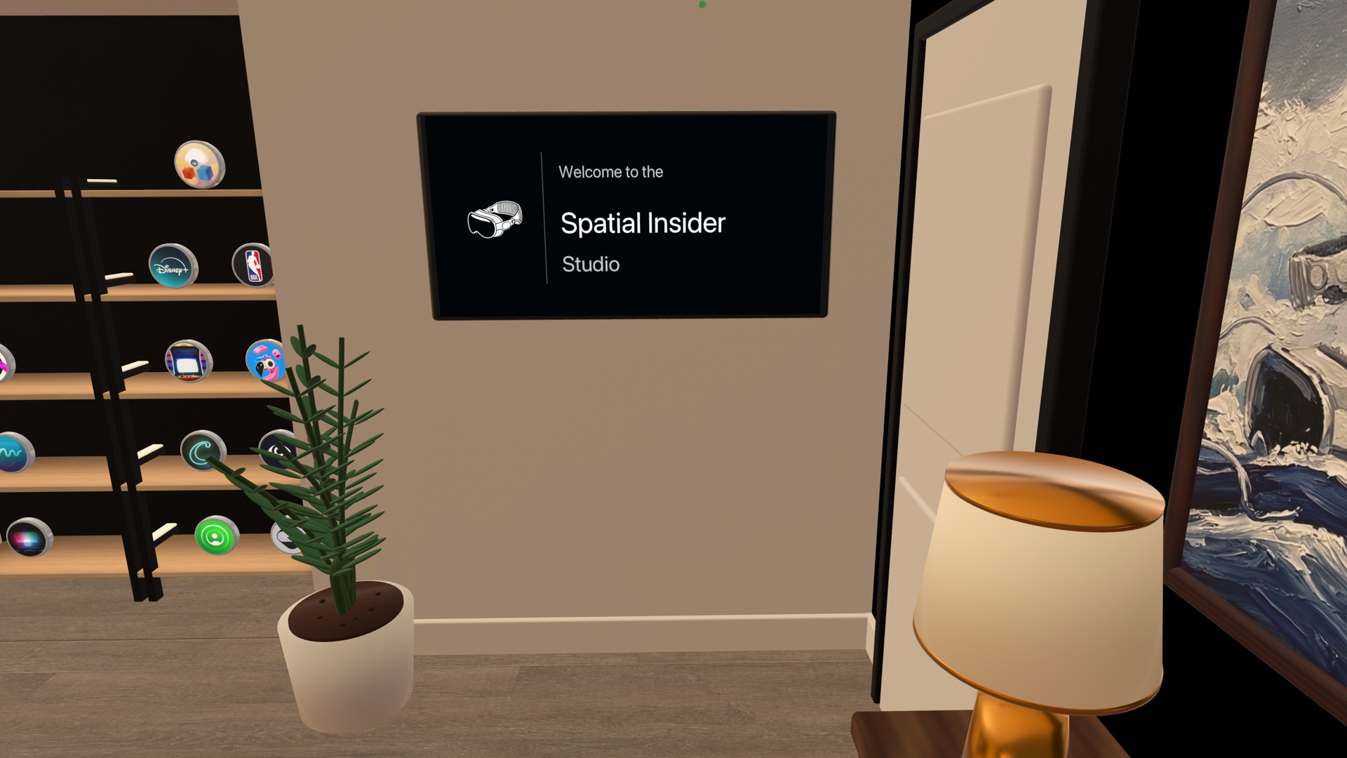 A welcome display for the Spatial Insider Studio beside shelves of round app icons inside the immersive environment