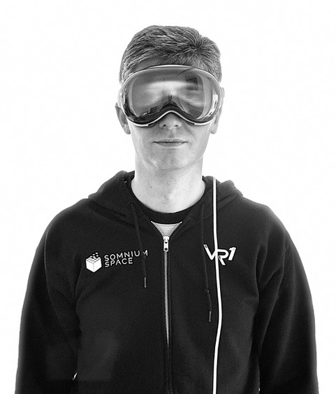 Black-and-white portrait of Artur Sychov wearing an Apple Vision Pro