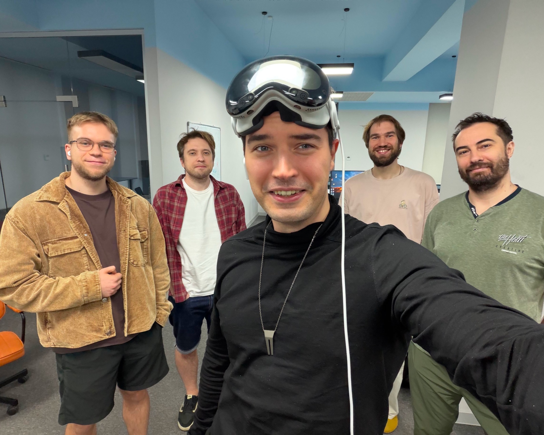 Five members of the Gracia team together in their office while Andrey Volodin wears Apple Vision Pro