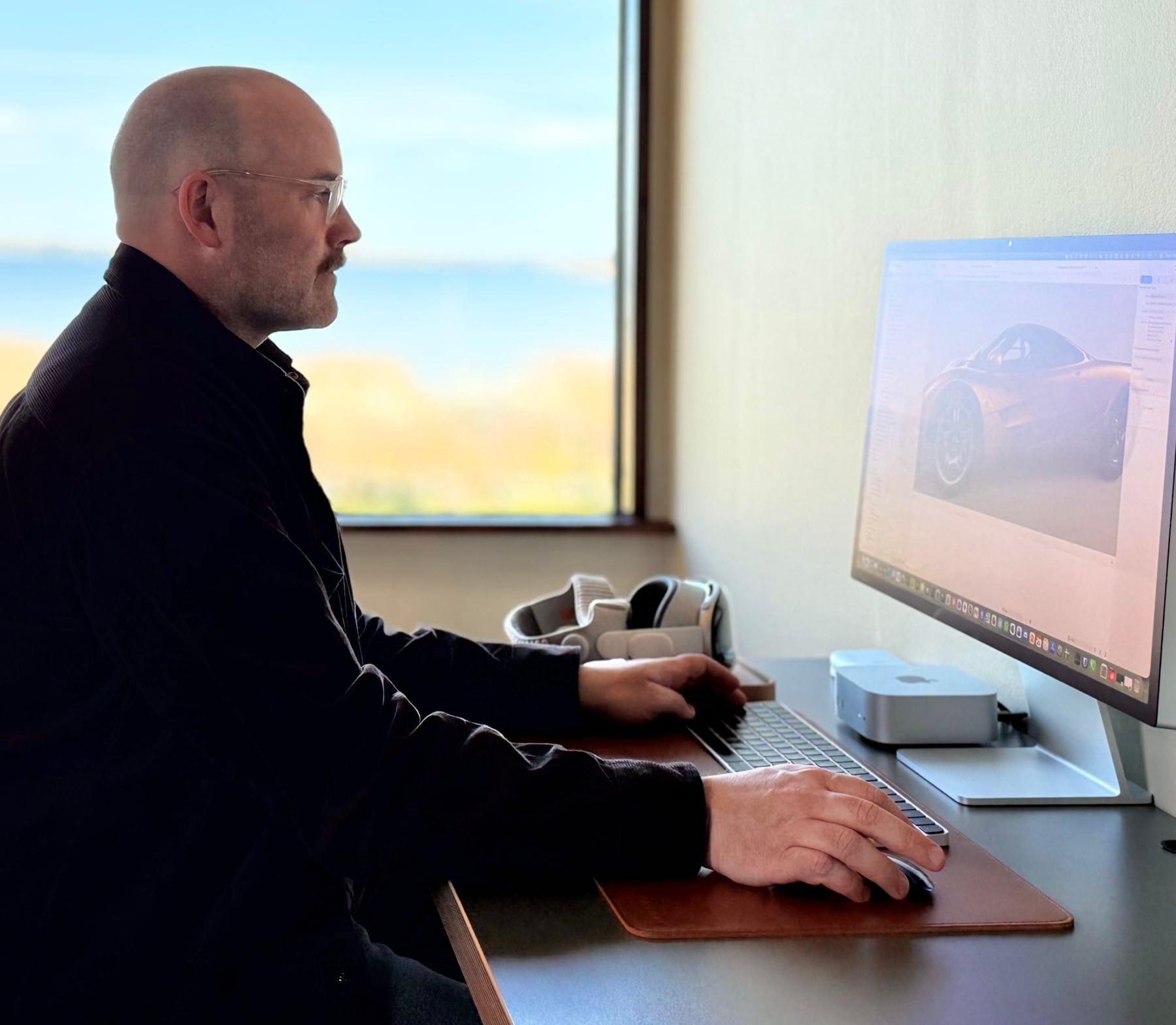 Peder Sandqvist working on a Caradise sports car model at his desk