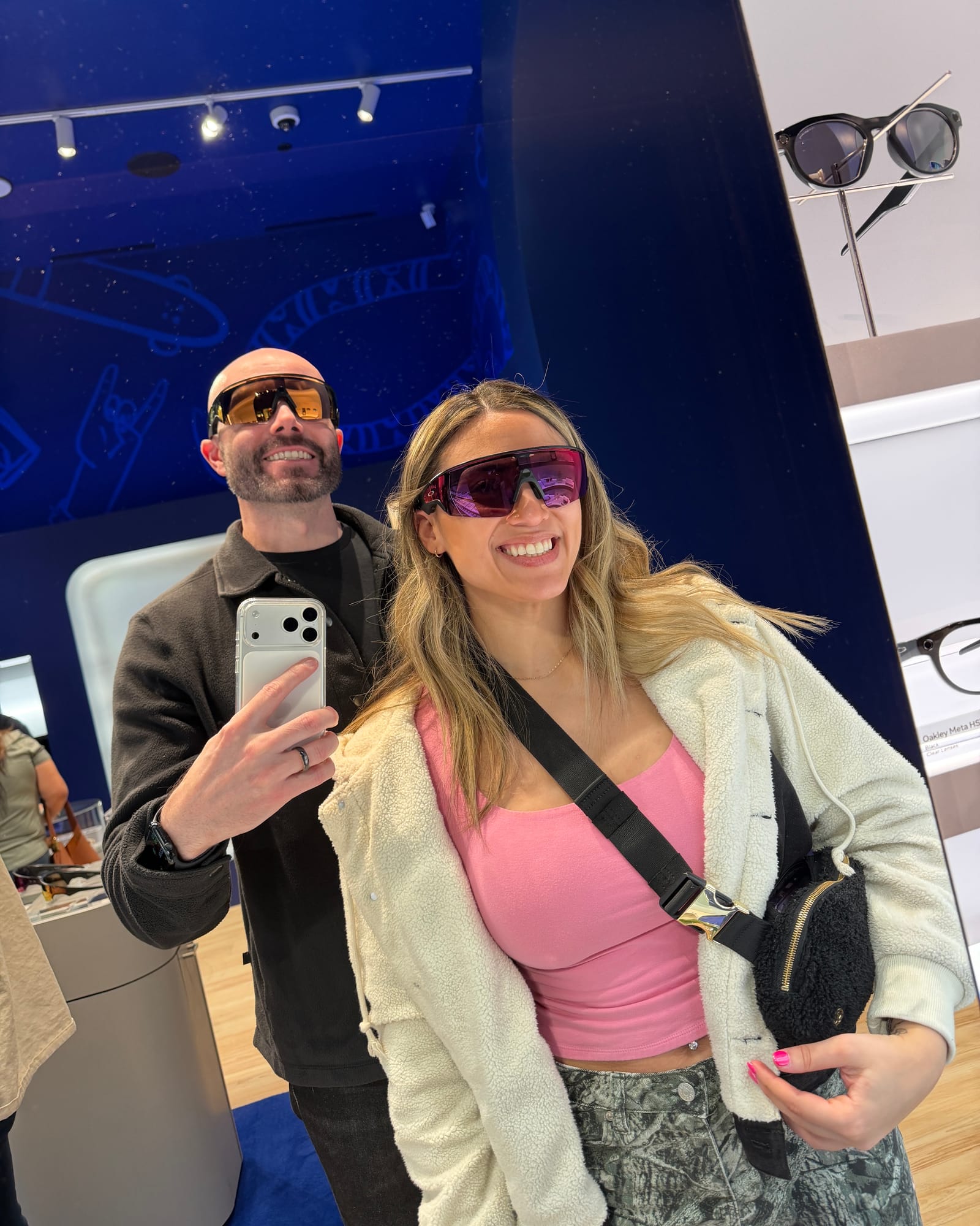Justin Ryan and a guest trying smart glasses at the Meta Store