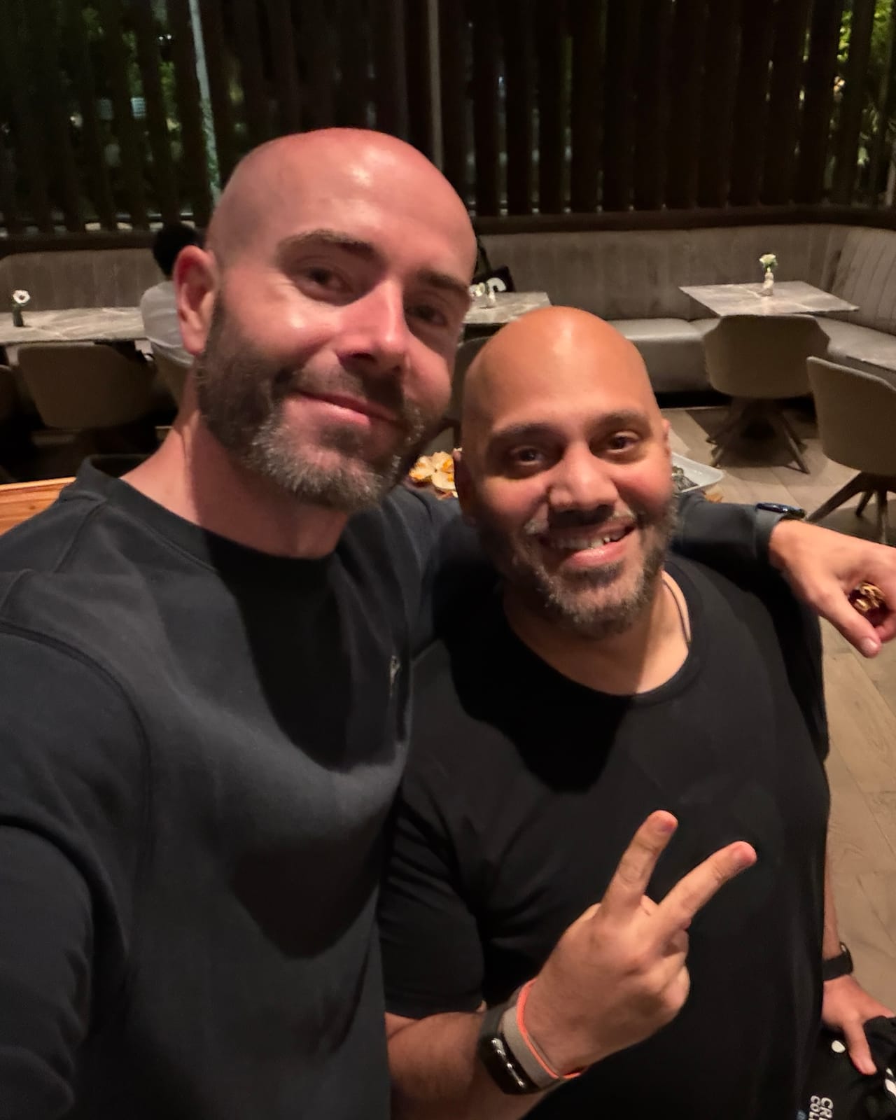 Justin Ryan with a guest at a restaurant
