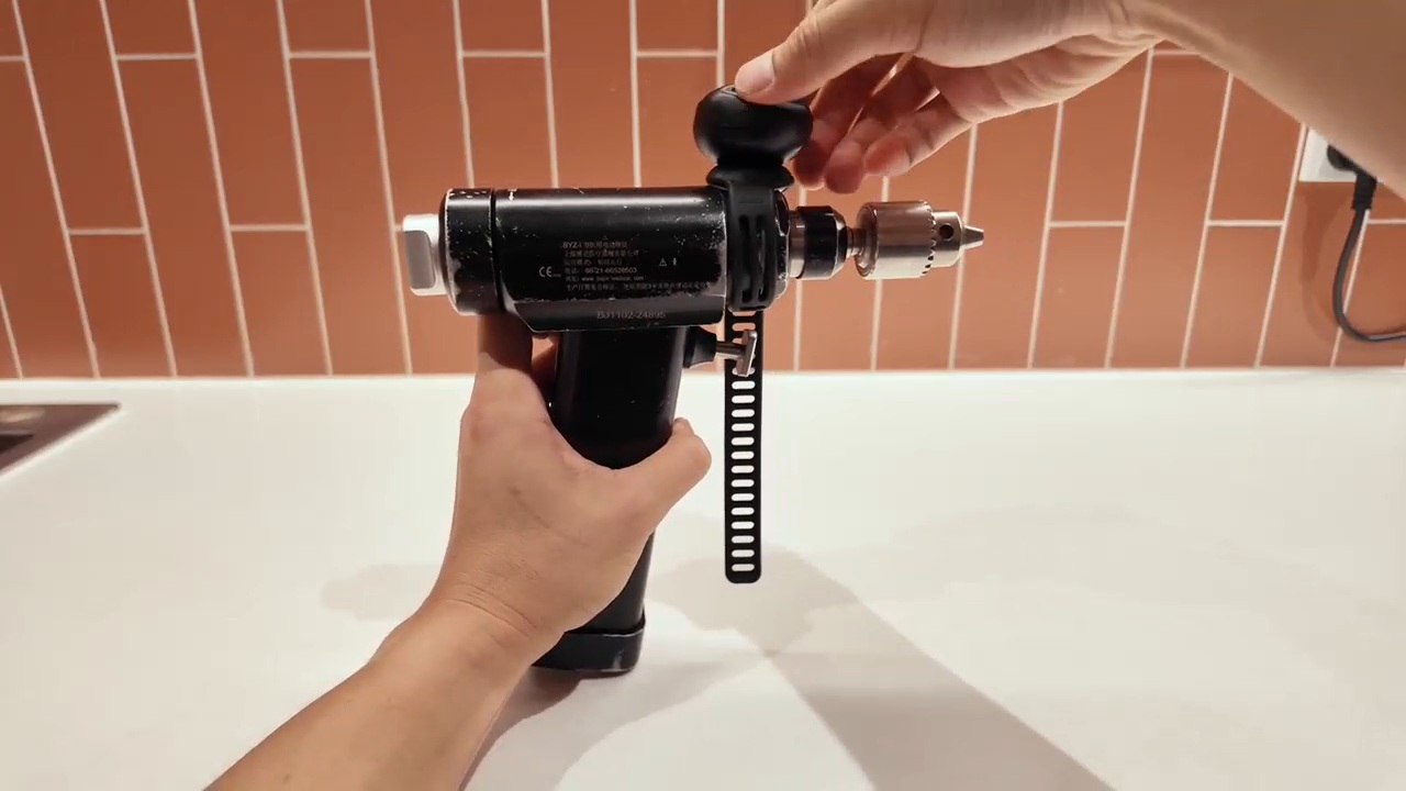 A person mounts seeMote Cap above a drill using a strap in DFRobot’s demonstration.