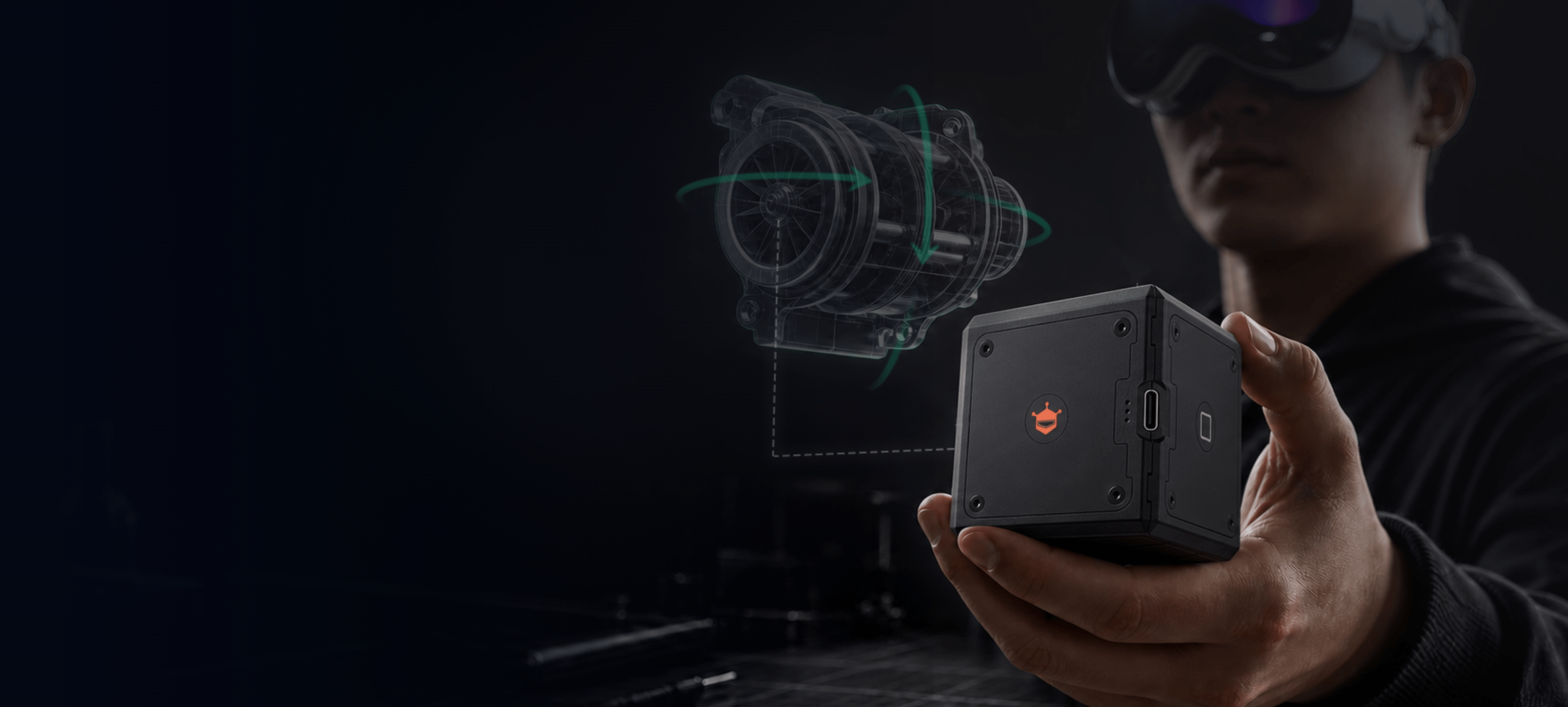 A person wearing Apple Vision Pro holds the black seeMote Cube with a digital object anchored to it