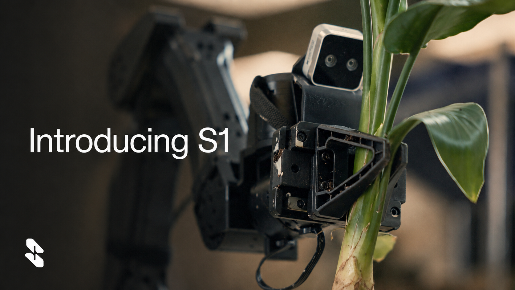A two-armed robot grips a leafy plant beside the words Introducing S1