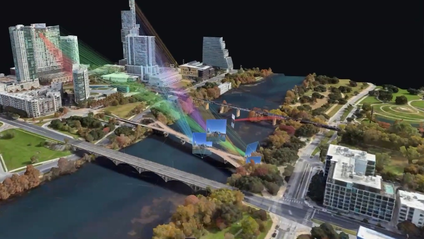 An Austin 3D map with colored rays connecting photos to their matched positions