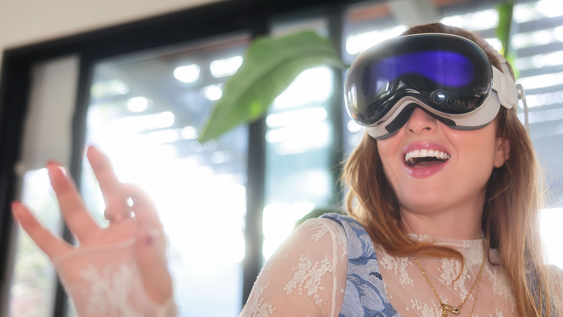 Keeley Turner wearing Apple Vision Pro and reaching forward in Spatial Film’s official photography.