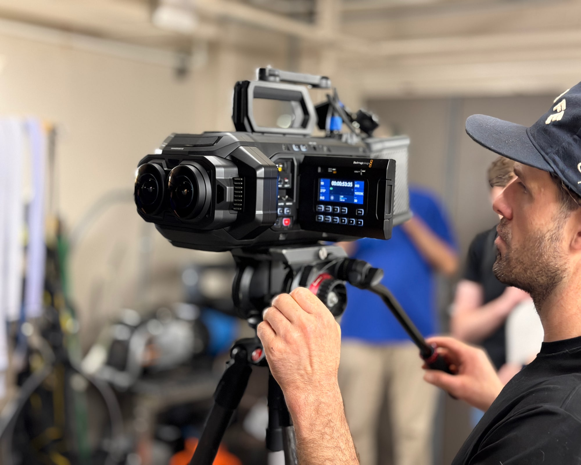 A camera operator works with the Blackmagic URSA Cine Immersive camera during filming at the Tennessee Aquarium
