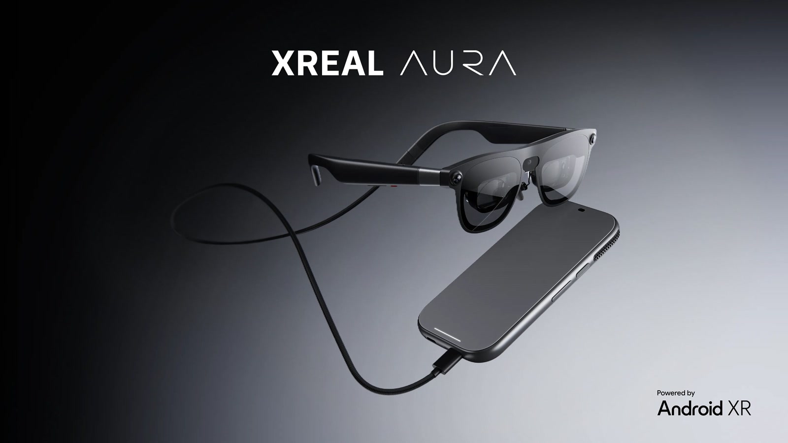 Official XREAL Aura product image showing the glasses, cable, and separate computing puck.